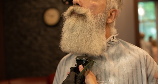 master makes beards correction barbershop salon close up photo 137441 467